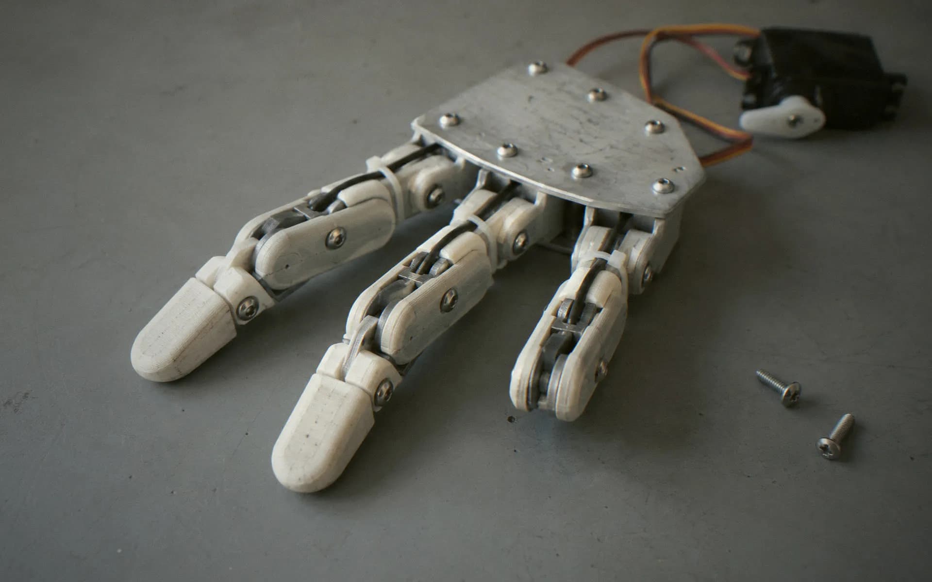 Robot hand prototype with tendon cables and servos