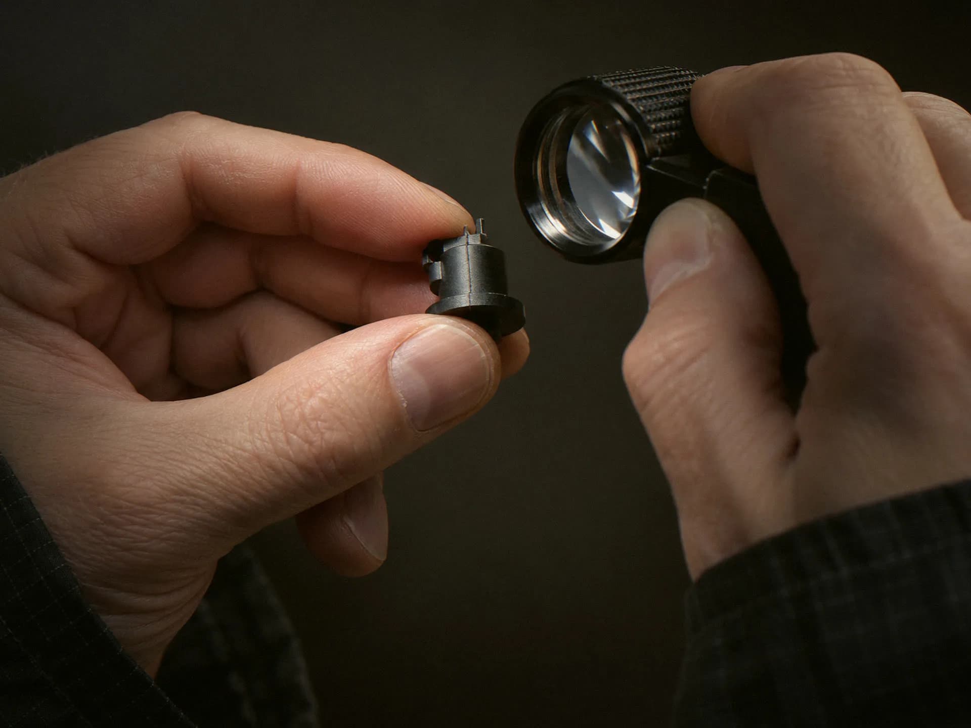 Molded part showing the gate mark and parting line under a loupe