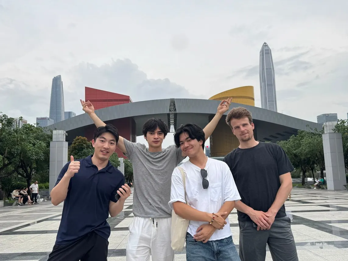 Founders posing together in front of the Shenzhen civic centre